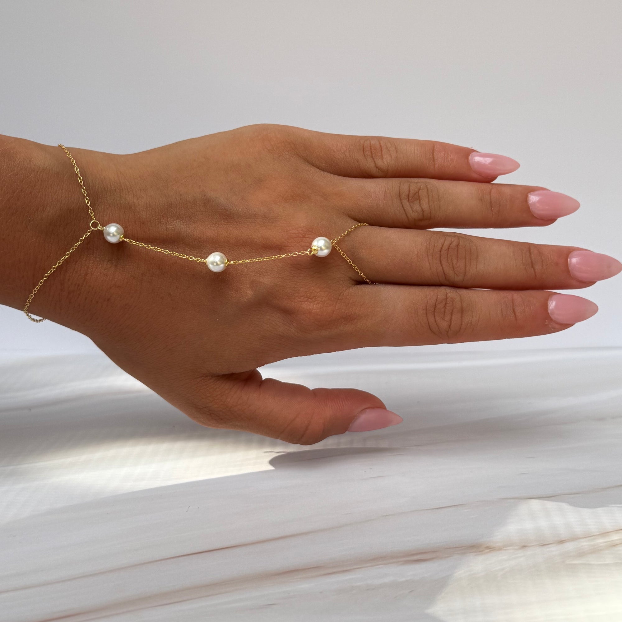 Pearls Halo Spark HandChain
